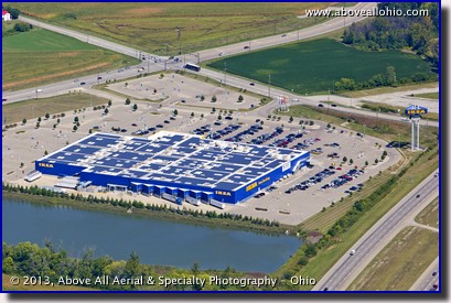 A shallow angle oblique aerial view of solar panels on the roof of an Ikea store near Cincinnati, Ohio.