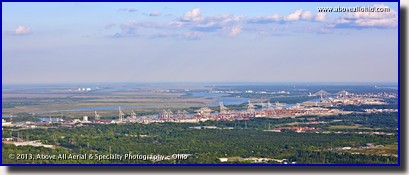 A panoramic aerial photo of the cranes and bridges along the Savannah River in Savannah, GA.